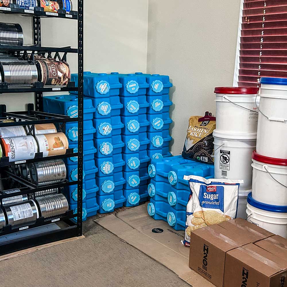 saganlife aquabrick food and water storage container 6 pack shown with emergency prep supplies